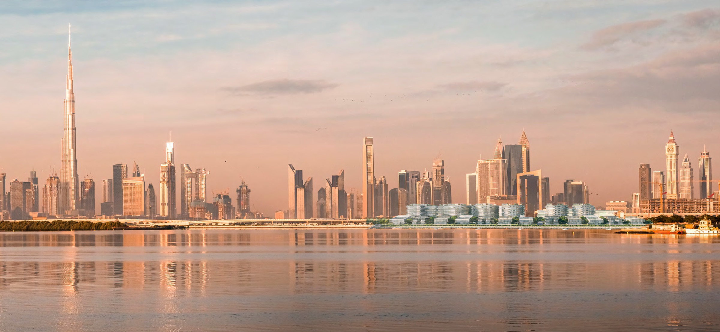 Dubai skyline reflected on Dubai Creek, with the Ritz-Carlton Residences on the 550m waterfront
